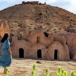 Excursion Désert avec SudTunisie.com : L'aventure ultime au cœur du Sud tunisien ! Vous rêvez d'une aventure époustouflante au cœur du désert, d'une escapade inoubliable dans les dunes infinies, de nuits sous les étoiles scintillantes ? L'excursion désert avec SudTunisie.com est le voyage que vous attendiez ! Laissez-nous vous guider à travers cette expérience extraordinaire et vous dévoiler tous les détails passionnants qui vous attendent. À la découverte des paysages envoûtants du désert Dès votre arrivée dans le Sud tunisien, vous serez subjugué par la beauté envoûtante des paysages désertiques. Les dunes majestueuses s'élèveront devant vous, offrant des panoramas à couper le souffle. Du sable doré à perte de vue, des vallées secrètes et des oasis verdoyantes, tout est réuni pour une aventure inoubliable. Que vous soyez amateur de photographie ou simplement en quête de moments magiques, vous ne serez pas déçu. Capturez les nuances changeantes du désert au lever et au coucher du soleil, immortalisez ces instants uniques dans cet écosystème à la fois rude et fascinant. Une immersion totale dans la culture saharienne L'excursion désert avec SudTunisie.com, c'est bien plus qu'une simple escapade. C'est une véritable immersion dans la culture saharienne. Vous aurez l'occasion de rencontrer les habitants du désert, des nomades au cœur chaleureux et à l'accueil généreux. Ils vous feront découvrir leur mode de vie traditionnel, leur artisanat ancestral et vous raconteront des légendes et des histoires transmises de génération en génération. Une occasion unique de plonger dans l'authenticité du désert tunisien. Des activités palpitantes pour tous les goûts L'excursion désert avec SudTunisie.com vous offre un éventail d'activités pour vivre des sensations uniques. Pour les amateurs d'adrénaline, les safaris en 4x4 dans les dunes sont une expérience à ne pas manquer. Frissonnez en dévalant les pentes de sable et en surmontant les crêtes élevées. Si vous préférez une approche plus douce, les balades à dos de chameau sont parfaites pour s'imprégner du rythme paisible du désert. Accompagné de chameliers expérimentés, vous explorerez les recoins les plus secrets de ce paysage saharien enchanteur. Des nuits inoubliables sous les étoiles Une des plus belles expériences de l'excursion désert avec SudTunisie.com est sans aucun doute les nuits passées sous les étoiles. Loin de toute pollution lumineuse, vous serez émerveillé par la voûte céleste étincelante. Dans un bivouac authentique, vous partagerez des instants conviviaux autour d'un feu de camp, dégustant des mets savoureux préparés par nos soins. Écoutez les contes et légendes du désert racontés par nos guides passionnés, pour une immersion totale dans la culture locale. Préparez-vous pour une aventure inégalée Maintenant que vous savez à quel point l'excursion désert avec SudTunisie.com est une aventure extraordinaire, voici quelques conseils pour vous préparer au mieux. Pensez à emporter des vêtements légers pour les journées chaudes et des couches supplémentaires pour les nuits plus fraîches. Apportez une casquette ou un chapeau, de la crème solaire et des lunettes de soleil pour vous protéger des rayons intenses du soleil. N'oubliez pas votre appareil photo pour capturer ces moments magiques et emportez un sac à dos avec de l'eau pour vous hydrater tout au long du voyage. Conclusion L'excursion désert avec SudTunisie.com est la promesse d'une aventure extraordinaire, une immersion totale dans la beauté et la richesse du désert tunisien. Des paysages envoûtants, une culture saharienne authentique, des activités palpitantes et des nuits étoilées vous attendent pour une expérience inoubliable. Alors, préparez-vous à vivre l'aventure de votre vie et laissez-vous emporter par la magie du désert avec SudTunisie.com !