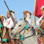 La Magie du Festival de Douz Le Festival de Douz est une célébration envoûtante au cœur du désert tunisien. Organisé chaque année dans la ville de Douz, connue comme la "porte du Sahara", cet événement emblématique offre une plongée fascinante dans la culture et les traditions nomades. L'Héritage Culturel du Festival Un Voyage au Cœur du Sahara Le Festival de Douz célèbre les traditions nomades du peuple du désert. Des spectacles de musique traditionnelle aux courses de dromadaires, en passant par l'artisanat local, chaque élément du festival témoigne de l'héritage riche et vivant des habitants du désert. Rencontres et Échanges Culturels C'est une occasion unique de rencontrer les nomades du Sahara, d'apprendre de leur mode de vie, de découvrir leurs coutumes ancestrales et de s'immerger dans une culture authentique et préservée. Les Attraits du Festival Spectacles Époustouflants Des démonstrations de danses folkloriques aux compétitions de fantasia, les spectacles offrent une expérience sensorielle unique et captivante pour tous les visiteurs. Marché des Artisans et Produits Locaux Le festival abrite également un marché animé où les artisans locaux exposent leurs créations. Des tapis berbères aux bijoux artisanaux, découvrez l'artisanat authentique du Sahara. Participez à l'Expérience du Festival de Douz avec SudTunisie.com Offres de Voyage Personnalisées SudTunisie.com vous propose des forfaits sur mesure pour vivre pleinement cette expérience inoubliable. Des hébergements confortables aux transferts, tout est prévu pour rendre votre séjour agréable. Accompagnement et Organisation Profitez d'un accompagnement expert pour découvrir le Festival de Douz dans les meilleures conditions. Une équipe dédiée vous guide tout au long de cette aventure culturelle unique. Conclusion : Plongez dans la Magie du Festival Le Festival de Douz est bien plus qu'un événement culturel ; c'est une immersion authentique dans la vie nomade du désert. Avec SudTunisie.com, embarquez pour une aventure fascinante au cœur du Sahara et vivez des moments inoubliables. {narrateur-article} Le Festival de Douz est une fenêtre ouverte sur les traditions et l'authenticité du Sahara. Avec SudTunisie.com, offrez-vous une expérience immersive au cœur d'une culture fascinante et vivez le Festival de Douz comme jamais auparavant.