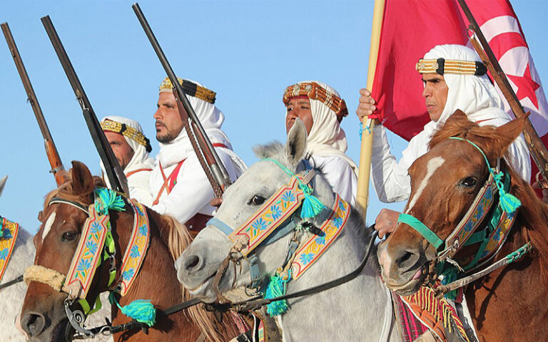 La Magie du Festival de Douz Le Festival de Douz est une célébration envoûtante au cœur du désert tunisien. Organisé chaque année dans la ville de Douz, connue comme la "porte du Sahara", cet événement emblématique offre une plongée fascinante dans la culture et les traditions nomades. L'Héritage Culturel du Festival Un Voyage au Cœur du Sahara Le Festival de Douz célèbre les traditions nomades du peuple du désert. Des spectacles de musique traditionnelle aux courses de dromadaires, en passant par l'artisanat local, chaque élément du festival témoigne de l'héritage riche et vivant des habitants du désert. Rencontres et Échanges Culturels C'est une occasion unique de rencontrer les nomades du Sahara, d'apprendre de leur mode de vie, de découvrir leurs coutumes ancestrales et de s'immerger dans une culture authentique et préservée. Les Attraits du Festival Spectacles Époustouflants Des démonstrations de danses folkloriques aux compétitions de fantasia, les spectacles offrent une expérience sensorielle unique et captivante pour tous les visiteurs. Marché des Artisans et Produits Locaux Le festival abrite également un marché animé où les artisans locaux exposent leurs créations. Des tapis berbères aux bijoux artisanaux, découvrez l'artisanat authentique du Sahara. Participez à l'Expérience du Festival de Douz avec SudTunisie.com Offres de Voyage Personnalisées SudTunisie.com vous propose des forfaits sur mesure pour vivre pleinement cette expérience inoubliable. Des hébergements confortables aux transferts, tout est prévu pour rendre votre séjour agréable. Accompagnement et Organisation Profitez d'un accompagnement expert pour découvrir le Festival de Douz dans les meilleures conditions. Une équipe dédiée vous guide tout au long de cette aventure culturelle unique. Conclusion : Plongez dans la Magie du Festival Le Festival de Douz est bien plus qu'un événement culturel ; c'est une immersion authentique dans la vie nomade du désert. Avec SudTunisie.com, embarquez pour une aventure fascinante au cœur du Sahara et vivez des moments inoubliables. {narrateur-article} Le Festival de Douz est une fenêtre ouverte sur les traditions et l'authenticité du Sahara. Avec SudTunisie.com, offrez-vous une expérience immersive au cœur d'une culture fascinante et vivez le Festival de Douz comme jamais auparavant.