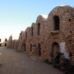 Envie d’un dépaysement total, d’un retour à l’essentiel, d’une aventure qui réveille vos sens ? Bienvenue dans le Sud tunisien, là où les dunes dorées s’étendent à perte de vue, où les villages berbères racontent des siècles d’histoire et où les nuits sous tente deviennent des souvenirs inoubliables. Nous vous invitons à vivre une expérience authentique : un circuit et excursion avec nuitée dans le désert sous tente, au cœur du Sahara. Pourquoi choisir une nuitée dans le désert tunisien ? Dormir sous une tente traditionnelle, en plein cœur du désert, ce n’est pas juste une activité touristique, c’est une immersion culturelle. Vous vous réveillez au chant du vent dans les dunes, vous dînez autour d’un feu de camp, les yeux rivés sur un ciel constellé d’étoiles. Et le matin, vous découvrez un lever de soleil qui teinte le sable d’or et de rose. Ce type de circuit est idéal pour les couples, les familles, ou les groupes d’amis en quête d’aventure et d’émotions. En partant de Tunis, Hammamet, Sousse, Monastir, Sfax, Djerba, Gabès, Bizerte, Kélibia ou Korba, vous pouvez facilement accéder à l’un des plus beaux joyaux naturels de la Tunisie. Pour découvrir l’ensemble de nos circuits désert sur mesure, cliquez ici 👉 https://sudtunisie.com/voyage/circuits-desert/ Un programme complet mêlant nature, culture et sensations Nos circuits sont pensés pour vous offrir une aventure complète, où chaque moment est soigneusement orchestré pour vous faire vivre le meilleur du Sahara. Voici un exemple de programme sur 2 jours et 1 nuit : 🚐 Jour 1 – Départ matinal depuis votre lieu de séjour (Tunis, Sousse, Djerba, etc.) avec prise en charge par notre service de navette aéroport et transport touristique 🏜️ Arrivée à Douz ou Ksar Ghilane, porte du désert 🐪 Balade à dos de dromadaire à travers les dunes 🍽️ Dîner traditionnel autour du feu de camp ⛺ Nuitée sous tente dans un campement nomade tout confort 🌄 Jour 2 – Lever de soleil, petit-déjeuner saharien 🧭 Exploration des oasis de montagne comme Chebika et Tamerza ou de villages troglodytes à Matmata 🚙 Retour en fin d’après-midi Et pour ceux qui aiment marcher et respirer l’air pur du désert, nous proposons également des circuits de randonnée dans le Sahara, que vous pouvez découvrir ici : 👉 https://sudtunisie.com/voyage/randonnee-montagne-sahara/ Des expériences uniques tout au long du circuit En choisissant notre excursion, vous vivez plus qu’un simple voyage. Vous découvrez une culture ancestrale, vous partagez un moment avec les habitants du désert, vous goûtez à une gastronomie locale simple et généreuse, et surtout, vous vous reconnectez à vous-même. Voici quelques moments forts de nos circuits : Visite de villages berbères et rencontre avec des artisans locaux Pause détente dans une source chaude naturelle à Ksar Ghilane Observation des étoiles avec un guide passionné d’astronomie Dégustation de pain traditionnel cuit sous le sable Retrouvez plus d’idées d’activités dans notre blog : 👉 https://sudtunisie.com/voyage/blog-excursions-tunisie/ Organisation et confort : rien n’est laissé au hasard Nous savons qu’un voyage réussi dépend aussi de l’organisation et du confort. C’est pourquoi nous mettons à votre disposition : Des véhicules climatisés récents avec chauffeurs professionnels Des guides locaux expérimentés francophones Des campements bien équipés avec sanitaires, douches, literie propre Des repas traditionnels et variés (tajines, couscous, grillades) Une assistance téléphonique 24h/24 pendant votre séjour Et pour recevoir un devis gratuit, adapté à votre nombre de participants, au lieu de départ et à la durée souhaitée, cliquez ici : 👉 https://sudtunisie.com/devis-voyage-desert-sud-tunisie-vacances-pas-cher-tunisie-sahara-tunisie/ Excursions thématiques à intégrer à votre circuit Pour personnaliser votre séjour, vous pouvez choisir des options originales : 🎨 Excursion photographique au coucher de soleil 🐾 Suivi des traces d’animaux dans les dunes 🧘‍♀️ Séance de yoga au lever du jour sur le sable 🎶 Soirée musicale avec des musiciens traditionnels sahariens Ces idées peuvent facilement être intégrées dans un programme plus large. Explorez nos excursions en Tunisie pour construire un circuit sur mesure. Avis des voyageurs : l’expérience racontée par ceux qui l’ont vécue Nous croyons que les meilleurs ambassadeurs de nos circuits, ce sont nos voyageurs. Et leurs avis parlent d’eux-mêmes : “Une expérience magique au cœur du désert tunisien. Tout était parfaitement organisé. Un grand merci à l’équipe Sud Tunisie !” – Sophie, Paris “Le feu de camp, les chants, le silence... Un moment hors du temps que je n’oublierai jamais.” – Ahmed, Marseille Vous pouvez consulter tous les commentaires ici : 👉 https://www.tripadvisor.fr/Attraction_Review-g293757-d31317516-Reviews-Sud_Tunisie-Tozeur_Tozeur_Governorate.html Départ facile depuis toute la Tunisie Que vous soyez à Tunis, Sousse, Djerba, Sfax, Gabès, Hammamet, Kélibia, Korba, Monastir ou même Bizerte, nos circuits commencent là où vous êtes. Nous organisons les navettes aller-retour, les hébergements avant ou après votre séjour dans le désert, et nous nous adaptons à votre emploi du temps. Pour tout départ, vous pouvez réserver facilement avec nos services de transport et navette aéroport ici : 👉 https://sudtunisie.com/services-navette-aeroport/ Conclusion : Offrez-vous un circuit inoubliable dans le Sahara tunisien Le Sud tunisien, ce n’est pas juste une destination, c’est une rencontre. Une rencontre avec la nature, avec l’histoire, et avec vous-même. Que vous partiez pour deux jours ou une semaine, vous reviendrez avec des souvenirs gravés dans votre cœur. Si vous cherchez à vivre un voyage hors du commun, en famille, en couple ou entre amis, nos circuits avec nuitée sous tente dans le désert tunisien sont faits pour vous. N’attendez plus pour planifier votre aventure ! 📩 Demandez votre devis gratuit ici 📍 Découvrez nos circuits : https://sudtunisie.com/voyage/circuits-desert/